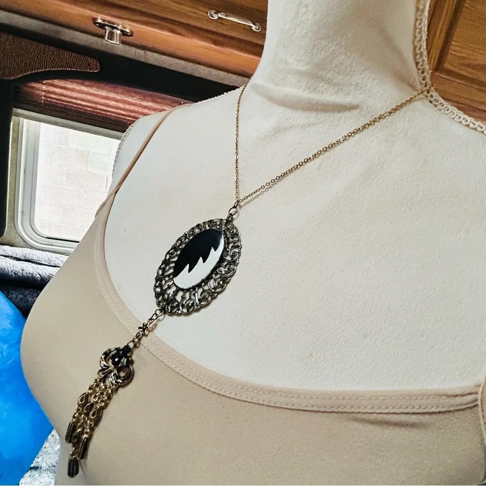 Handcrafted Cruella de Vil cameo bat accent pendant on chain necklace